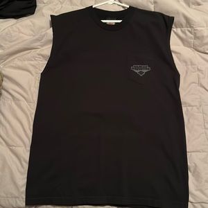 Sleeveless tee, heavy material. It’s large for an XL